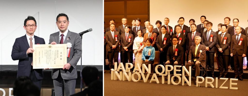 Mujin's co-founder Issei Takino takes a picture with the Prime Minister's award at the Japan Open Innovation Prize ceremony