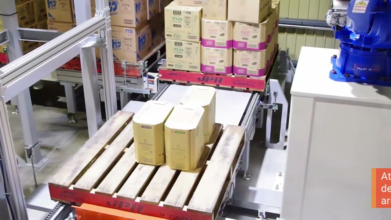 Close-up of a pallet being depllatized by a blue mujin robot
